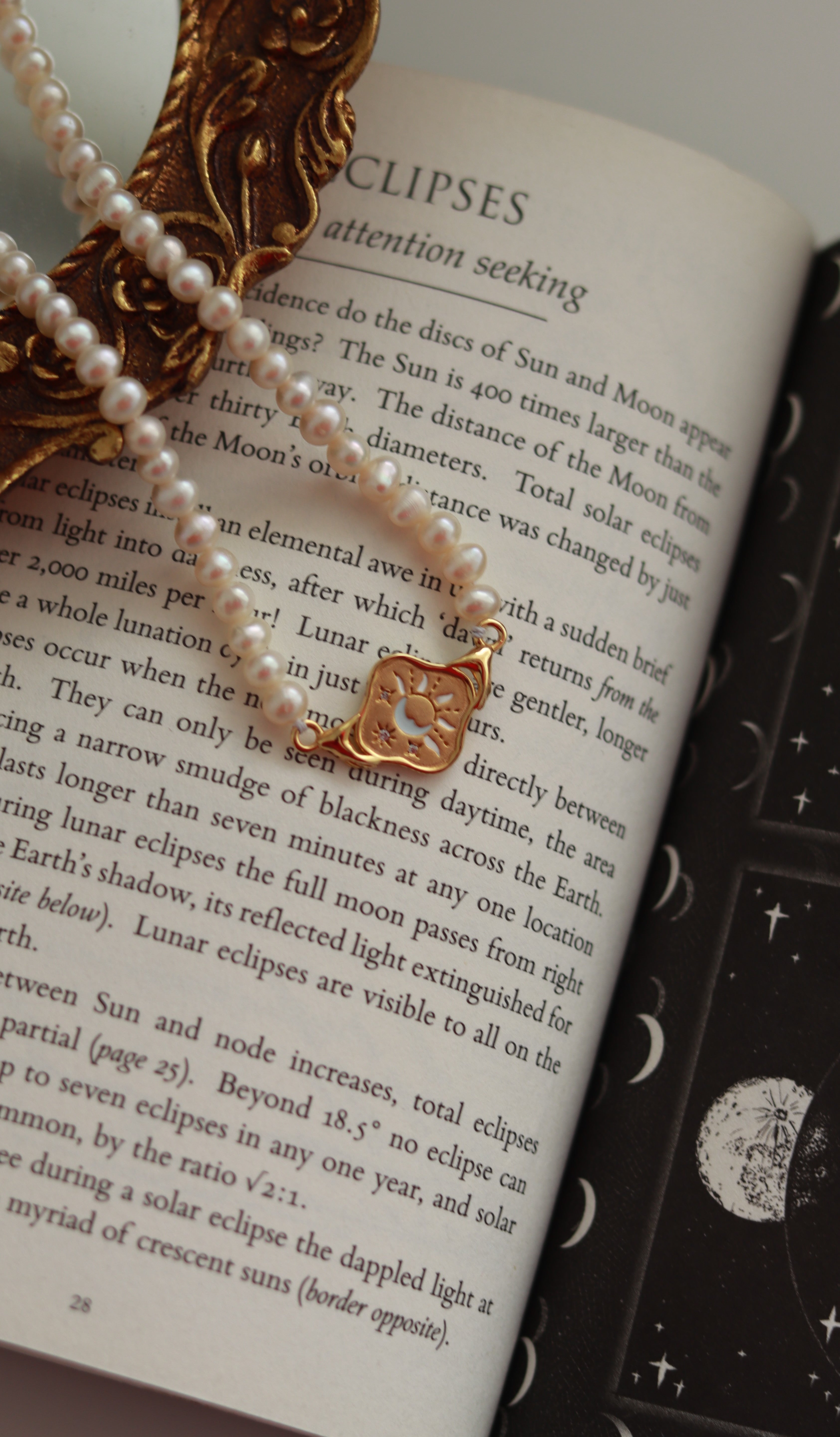 the gold pendant with pearl chain 