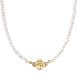 Pearl necklace with a gold clasp on a white background